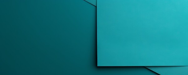 Turquoise background with dark turquoise paper on the right side, minimalistic background, copy space concept, top view, flat lay