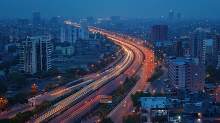 Fototapeta na wymiar City Lights. Traffic Streams Along Highway - A bustling city at night, showcasing traffic flowing along a highway, capturing the energy of urban life.