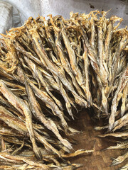 Dried Bombay Duck fish stacked for sell in a store