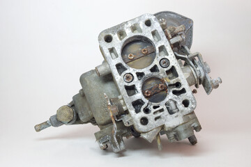 bottom side of old carburetor. Showing dual chambers with closed rusty throttle valves - obrazy, fototapety, plakaty