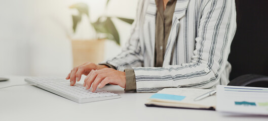 Computer, hands and business with woman, keyboard and typing for email and company website news....