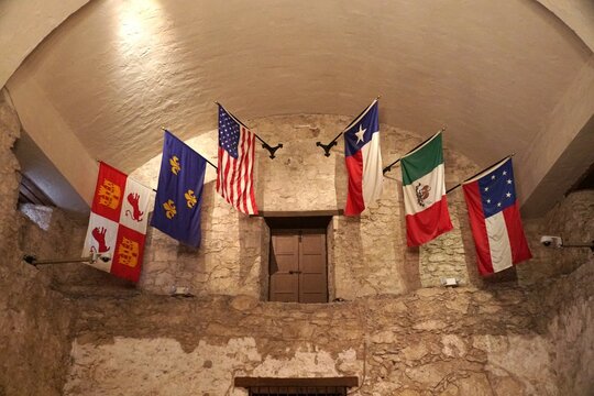San Antonio, Texas, U.S - April 6, 2024 - Six flags inside of the Alamo church, representing the six nations to rule over the state