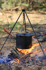 smoked kettle over fire - 785596429