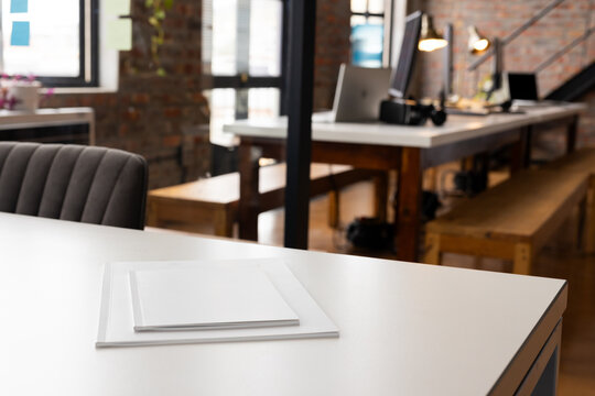 A white book resting on table in a modern office space