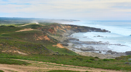 land and seascape at the rocky coastline of the Atlantic Ocean near Porto Covo near Sines, Portugal, Europe - 785612480