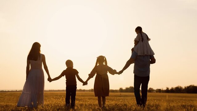 happy family child kid baby together teamwork dream fly children's dream silhouette sunset field park sun father mother, nature walk family, big family leisure, sunset holding hands, golden hour
