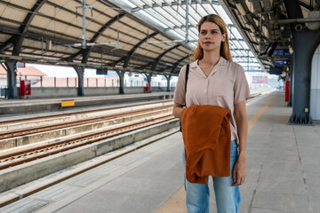 Young Woman Waiting Alone at Train Station