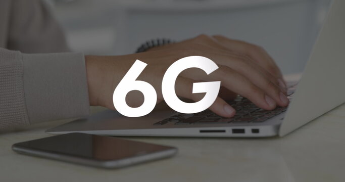 Image of 6g text over hands using laptop