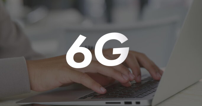 Image of 6g text over hands using laptop