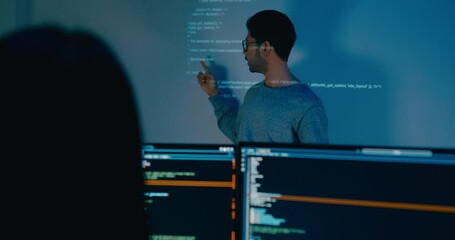 Group adult Asia male software developers mentor leader manager talk strategy plan to executive write prompt AI bot IT app program nomad, video game, designer, data center. Projecting slideshow code. - Powered by Adobe