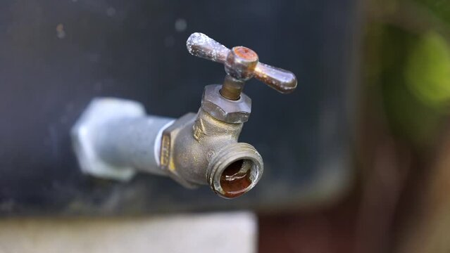 Water drip from an outdoor faucet 