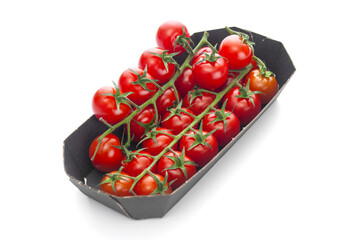 Ripe cherry tomatoes in retail packaging on a white background
