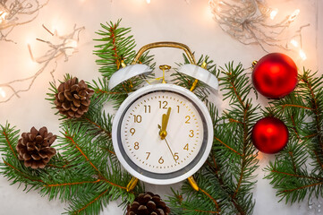 Analog white retro alarm clock on fiery background. Idea New year concept