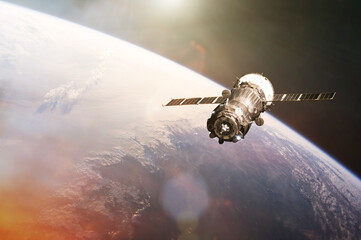Satellite launch into space on Earth background. Elements of this image furnished by NASA. © Paopano