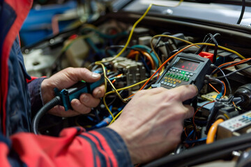 Technician Testing Automotive Electrical System
