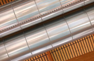 pipes for the industrial building s heating and cooling system under the roof. - 785641024
