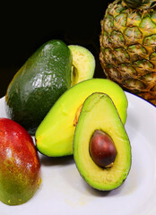 tropical fruits pineapple avocado and mango rich in vitamins - 785642407