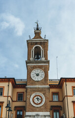 Fototapeta na wymiar old town hall clock tower in downtown rimini city