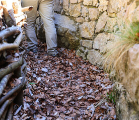legs of the patrolman in the trench during the watch - 785645421