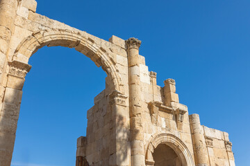 Gate South against the blue sky at ruins of Jerash.  Jordan.