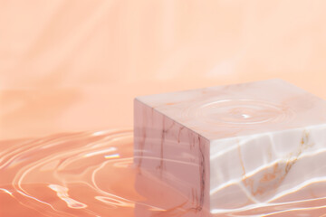Flat lay of empty marble square podium on transparent water with waves. Peach fuzz background. Product presentation concept - 785650495