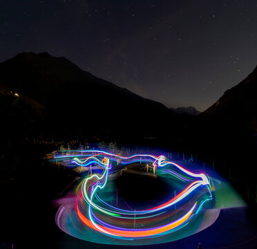 Long exposure of light trails on a bike path at night