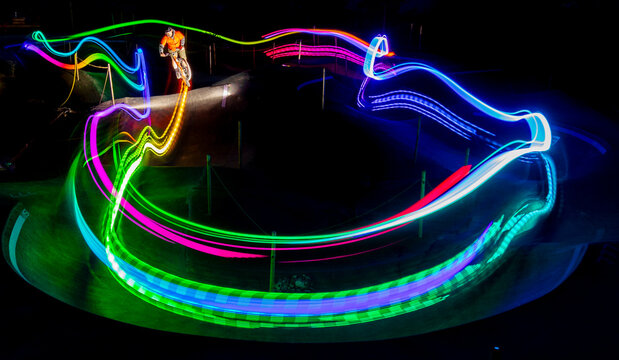 Summer night cycling with vibrant light trails