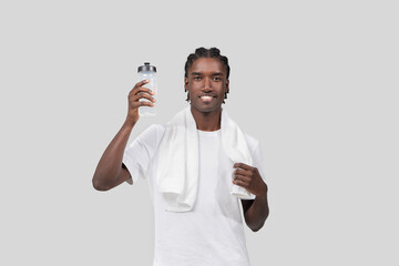 Smiling man with towel and water bottle
