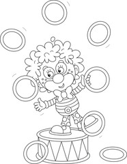 Funny red circus clown balancing on a big drum and juggling with toy hoops in a fun performance, black and white vector cartoon illustration for a coloring book