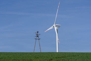 
WIND FARM - Turbines in a sunny weather landscape
