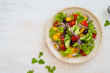Plate of fresh salad with vegetables on white wood rustic background - 785666640