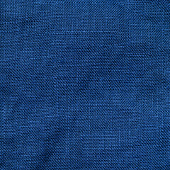 Abstract extreme close up linen textured background made of classic blue 2020 color. Color of year 2020 linen textile backdrop. COY2020 concept. Copy space for text. Square crop