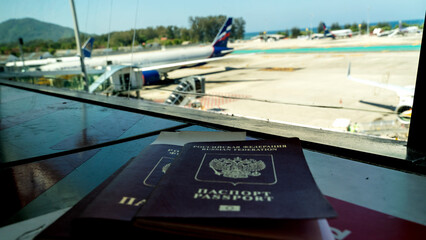 Fototapeta premium Passport lies on a chair at the airport
