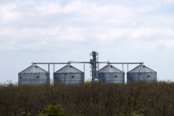 industrial grain silos for agriculture in a rural landscape