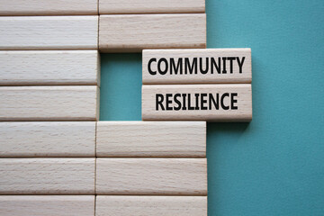 Community Resilience symbol. Wooden blocks with words Community Resilience. Beautiful grey green background. Business and Community Resilience concept. Copy space.