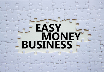 Easy Money Business symbol. Concept words Easy Money Business on white puzzle. Beautiful white...