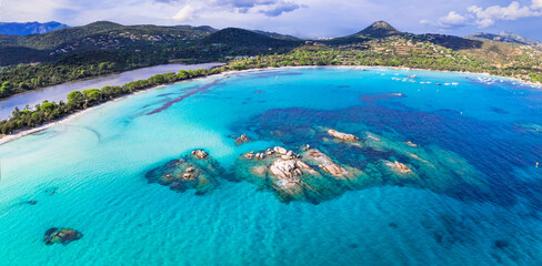 Best beaches of Corsica island - aerial view of beautiful Santa Giulia long beach with sault lake...
