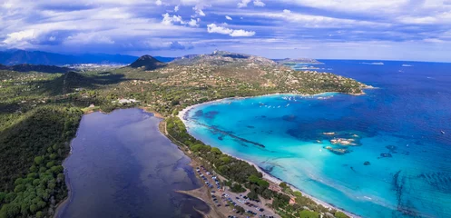 Photo sur Plexiglas Plage de Palombaggia, Corse Best beaches of Corsica island - aerial video of beautiful Santa Giulia long beach with sault lake from one side and turquoise sea from other