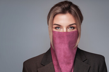 Portrait of a woman with stylish  wild rag covering her face