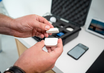 A technician works with a demo kit of the smart home system