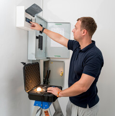 A technician works with a demo kit of the smart home system