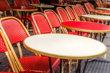Typical table and chairs in the streets of Paris, France