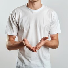 Man in a white t-shirt gesticulating with open hands