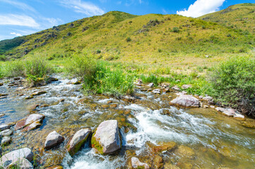 Enjoy the serene beauty of nature in the heart of the mountains. Watch the river flow gracefully through the rocky canyon. Enjoy breathtaking views and feel a sense of peace and tranquility.