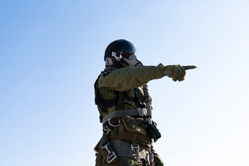 fighter jet pilot. A man in a military, in pilot suit uniform.