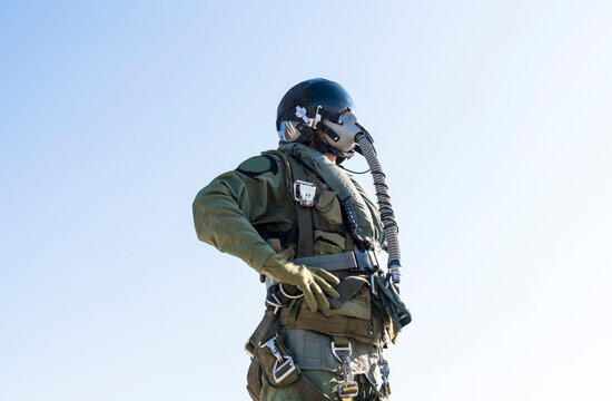fighter jet pilot. A man in a military, in pilot suit uniform.