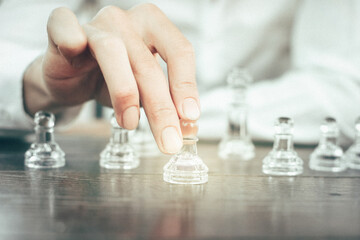 business man playing with chess board game. business strategy concept