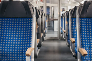 Rows of seats on an empty modern train, travel concept, selective focus.