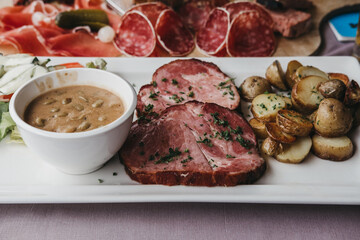 Traditional Luxembourgish dish Judd mat Gaardebounen on a plate, selective focus.