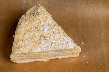 multi-layered cake made of buttercream and thin wheat cakes